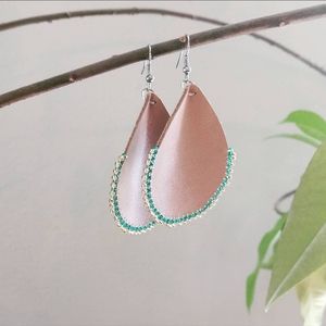 Handmade beaded and leather earrings - green and tan.